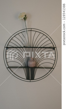Wall mounted decorative shelf with minimalist design and modern decor elements showcasing a flower vase Wall mounted decorative shelf with minimalist design and modern decor elements showcasing a flower vase 128541386
