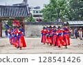 Red-clad guards appearing at the changing of the guard ceremony at Gyeongbokgung Palace in Seoul (AI generated from original image) 128541426