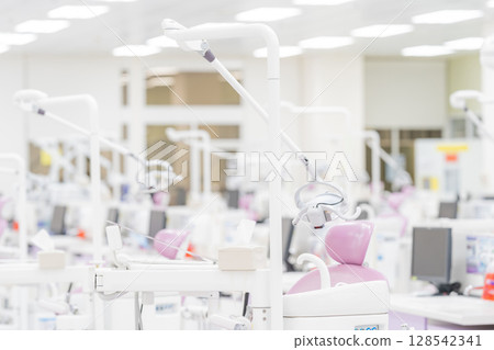 Many modern dental equipment and seats in a hygiene and sterile dental training room in the hospital. 128542341