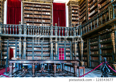 Coimbra, Portugal - Mar 14, 2025: The Johannine Library, Biblioteca Joanina in the University of Coimbra, Portugal Coimbra, Portugal - Mar 14, 2025: The Johannine Library, Biblioteca Joanina in the University of Coimbra, Portugal 128543677