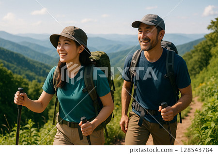 A male and female pair enjoying summer mountain climbing 128543784