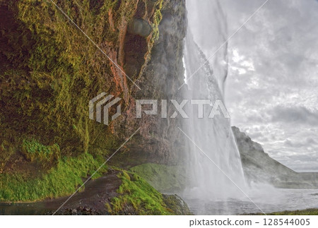 Behind Seljalandsfoss waterfall Iceland misty path 128544005