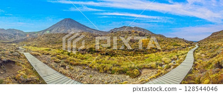 Tongariro boardwalk trail with wide sky view Tongariro boardwalk trail with wide sky view 128544046