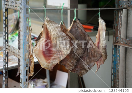 Dried Skate Wings Hanging in Korean Traditional Market 128544105