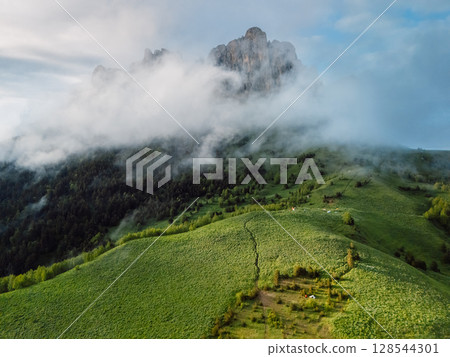 Aerial view of rock mount Bolshoy Tkhach with clouds in Caucasus mountains 128544301