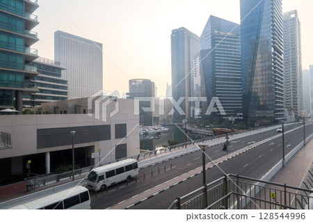 Dubai, UAE - September 29, 2024 Transport interchange in the city, organization of traffic of cars and pedestrians. Editorial 128544996