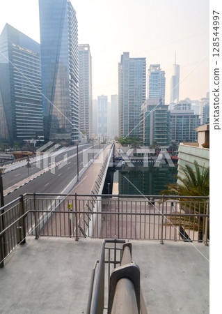 Dubai, UAE - September 29, 2024 Transport interchange in the city, organization of traffic of cars and pedestrians. Editorial Dubai, UAE - September 29, 2024 Transport interchange in the city, organization of traffic of cars and pedestrians. Editorial 128544997