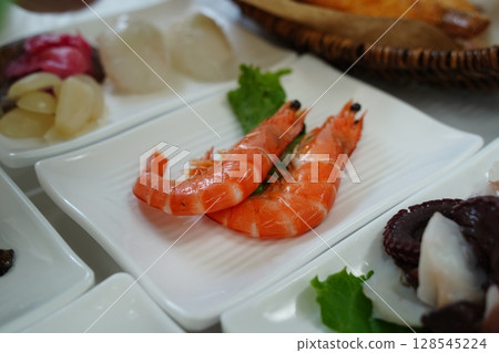 Close-up of Two Cooked Prawns on White Plate Close-up of Two Cooked Prawns on White Plate 128545224