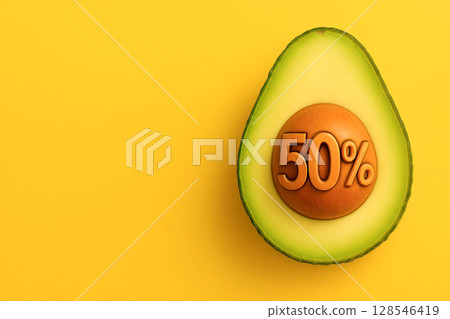 Half avocado with 50 percent on seed isolated on yellow background 128546419