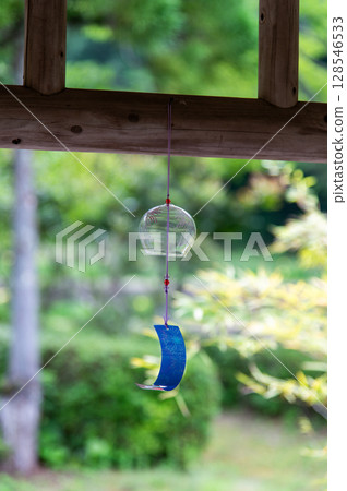 Wind chimes swaying in the wind 128546533