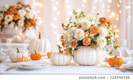 Halloween: Pastel flower arrangement and white pumpkin on an elegant table 128546586