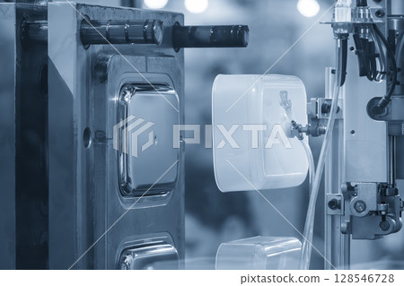 The food container production process by automatic system from plastic injection mold machine. The food container production process by automatic system from plastic injection mold machine. 128546728