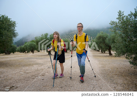 Young Scandinavian Couple Hiking in a Picturesque Mountainous Landscape Young Scandinavian Couple Hiking in a Picturesque Mountainous Landscape 128546841