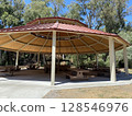 Summer sunlight pours in: A spacious rest area in the park 128546976
