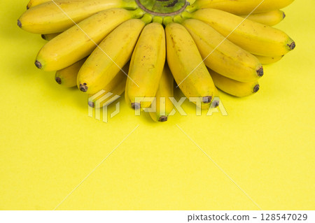 Bunch of mini baby bananas, copy space for text 128547029