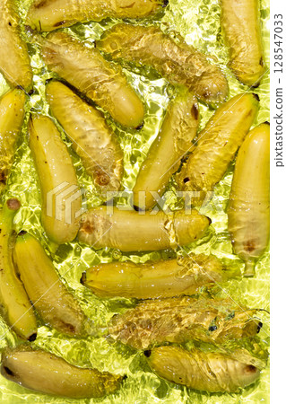 Fresh Yellow Baby Bananas Dropping in Water Fresh Yellow Baby Bananas Dropping in Water 128547033