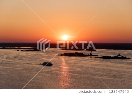 Golden Sunset Over Volga River with Cruising Ship 128547943