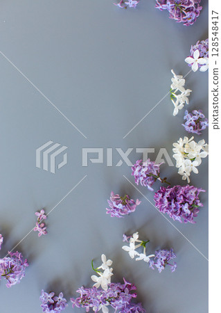 Romantic lilac bouquet on gray background Romantic lilac bouquet on gray background 128548417