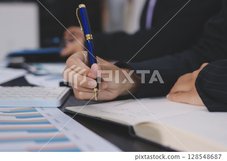 Team of business people working together in the meeting room office,teamwork background charts and graphs banner, double exposure successful teamwork,business planning concept. Team of business people working together in the meeting room office,teamwork background charts and graphs banner, double exposure successful teamwork,business planning concept. 128548687