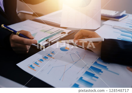 Team of business people working together in the meeting room office,teamwork background charts and graphs banner, double exposure successful teamwork,business planning concept. Team of business people working together in the meeting room office,teamwork background charts and graphs banner, double exposure successful teamwork,business planning concept. 128548717