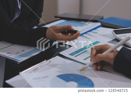 Team of business people working together in the meeting room office,teamwork background charts and graphs banner, double exposure successful teamwork,business planning concept. Team of business people working together in the meeting room office,teamwork background charts and graphs banner, double exposure successful teamwork,business planning concept. 128548725