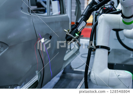 3D scanner on robotic arm measure the accuracy of automotive parts. in industrial plants 128548804