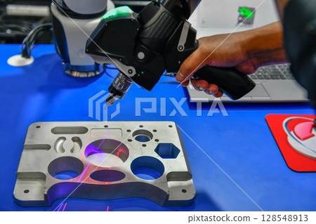 Portable 3D Auto parts handheld scanner is scanning to measure size and texture for future product development production in the automotive industry 128548913