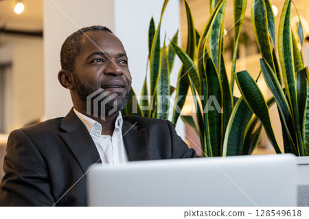 African american businessman working in the office and looking busy 128549618