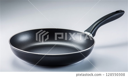 Product photo of a black frying pan placed on a pale gradient background 128550308