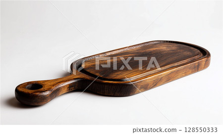 一塊深棕色的木砧板漂浮在空中 一塊深棕色的木砧板漂浮在空中 128550333