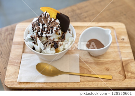 Chocolate orange shaved ice with chocolate sauce Chocolate orange shaved ice with chocolate sauce 128550601