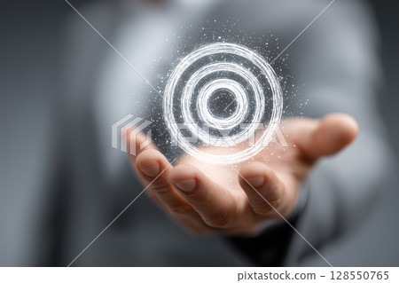 Businessman presents virtual target board in a modern business environment 128550765