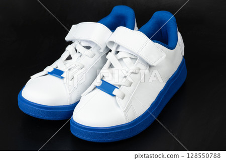Stylish white and blue sneakers designed for everyday comfort and fashion 128550788
