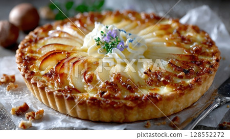 Autumn-inspired pie featuring fanned pear slices and creamy goat cheese on golden pastry, evoking cozy, homemade charm. Autumn-inspired pie featuring fanned pear slices and creamy goat cheese on golden pastry, evoking cozy, homemade charm. 128552272