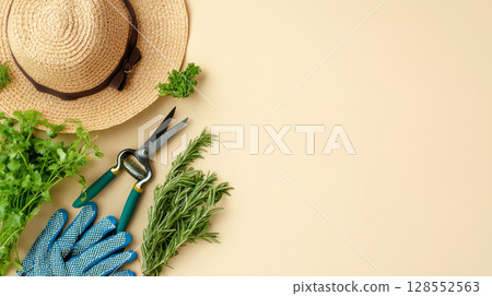 Minimal garden lifestyle setup with tools and greenery on soft neutral background. 128552563