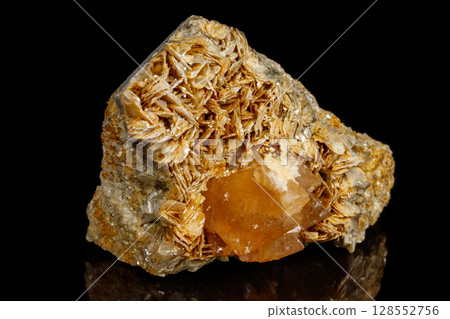 Macro Mineral Stone Sheelit on a black background Macro Mineral Stone Sheelit on a black background 128552756