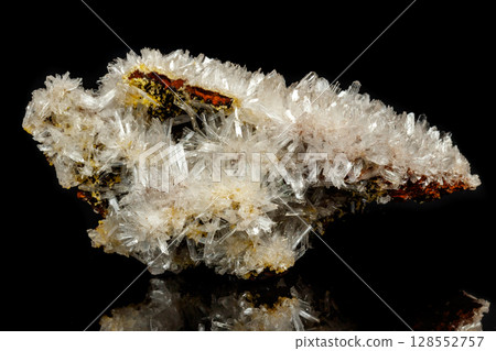 Macro mineral stone crystals Hemimorphite rock on a black background Macro mineral stone crystals Hemimorphite rock on a black background 128552757