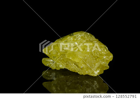 Macro mineral sulfur stone on a black background 128552791