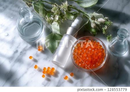 Minimalist flatlay with beauty product and scientific ingredients for modern wellness concepts. 128553779