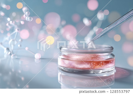 Conceptual biotech beauty photo with pipette and reflective textures in soft blue setting. 128553797