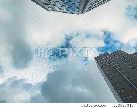 Looking up at the clouds and city sky after a typhoon 128553813