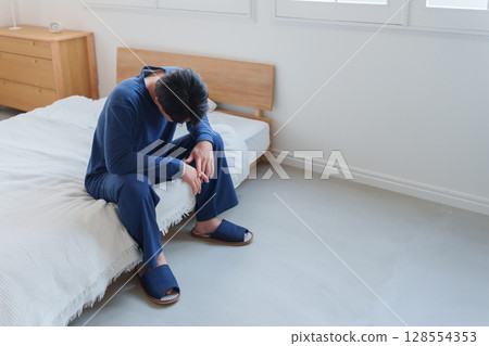 A man falling in bed 128554353