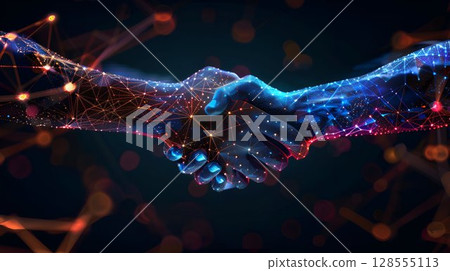 In a dimly lit room, two hands are clasping each other firmly 128555113