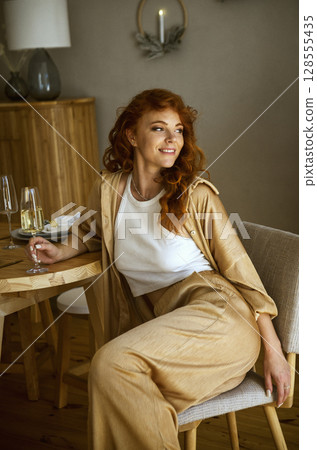 A person sitting on a table A person sitting on a table 128555435