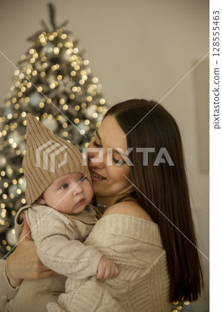 A woman holding a baby A woman holding a baby 128555463