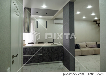 The kitchen is very bright with a modern design. The kitchen is very bright with a modern design. 128555528