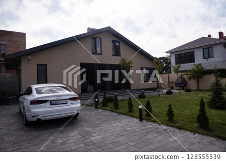 Interior house of a private household. there is a car in the yard. 128555539