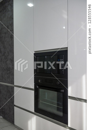 Covered space in front of the house for relaxation. Laid out with dark tiles. 128555546