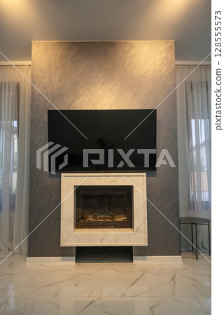 Fireplace in the living room. Fireplace in the living room. 128555573