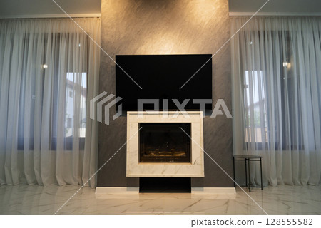 Fireplace in the living room. 128555582